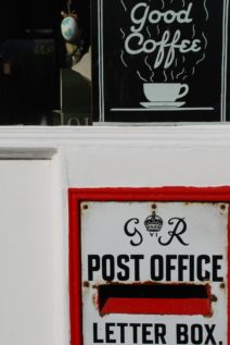 Postbox and coffee sign