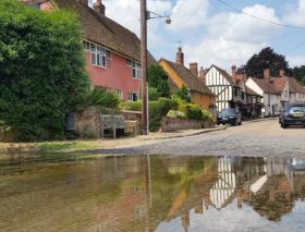 A ford across a road in a village