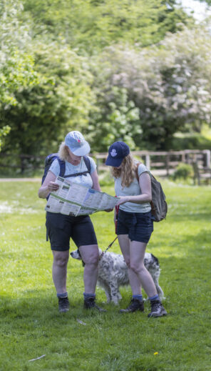 Walkers studying the walk leaflet