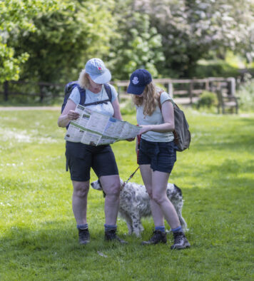 Walkers studying the walk leaflet